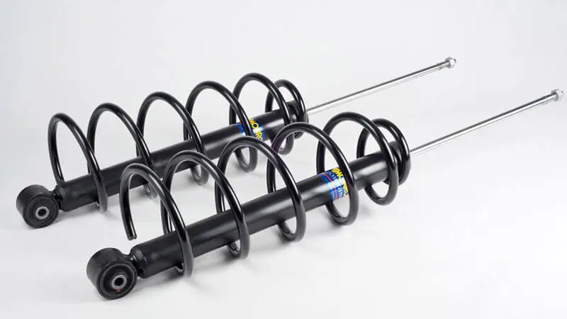 Foto de un conjunto de chasis como muelles y amortiguadores.